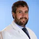 La imagen muestra al Dr. Aitor Hernández Hernández, especialista en Cardiología de la Clínica Universidad de Navarra. El Dr. Hernández se dedica al diagnóstico y tratamiento de enfermedades cardiovasculares.